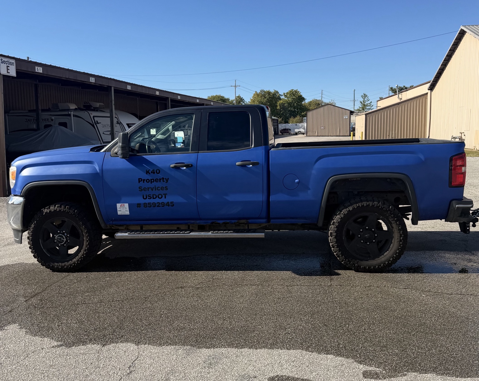 Blue K40 Property Services GMC truck